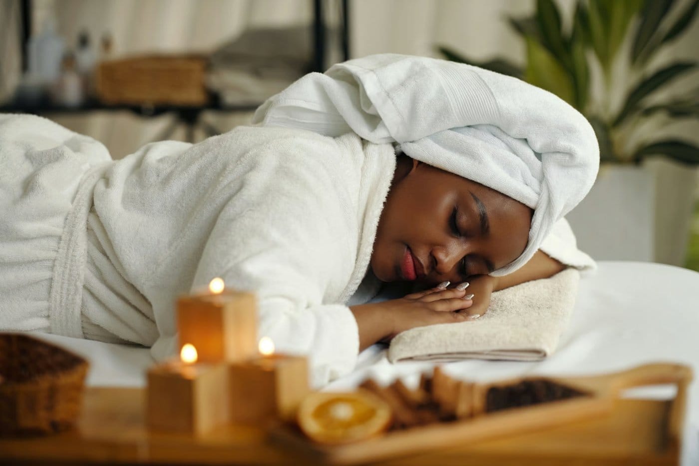 Rolled towels and candles in the calm Flamingo House Spa studio in Nanaimo