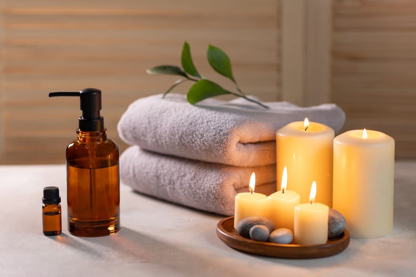 Candles, stones, essential oils and rolled towels set out in the cozy Flamingo House studio