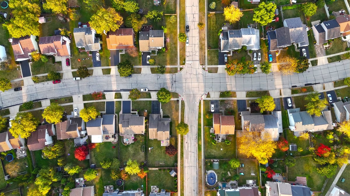 Top-down aerial view of a peaceful suburban neighborhood with colorful autumn trees near Lantzville on Vancouver Island